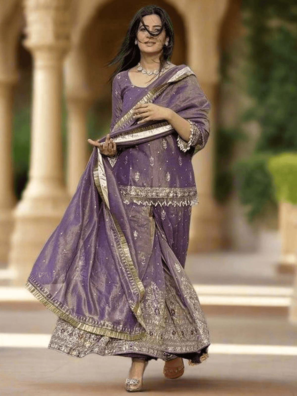 Elegant maroon embroidered kurta set with intricate designs, perfect for festive occasions