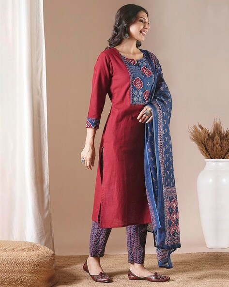 Elegant maroon embroidered kurta set featuring detailed blue embroidery and comfortable fit