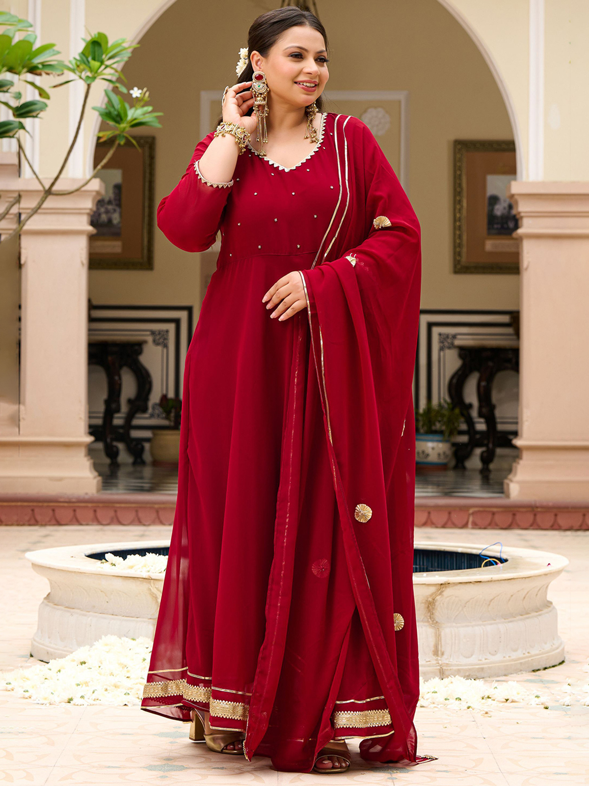 Elegant maroon zari anarkali kurta with dupatta featuring intricate embroidery and a flowing design