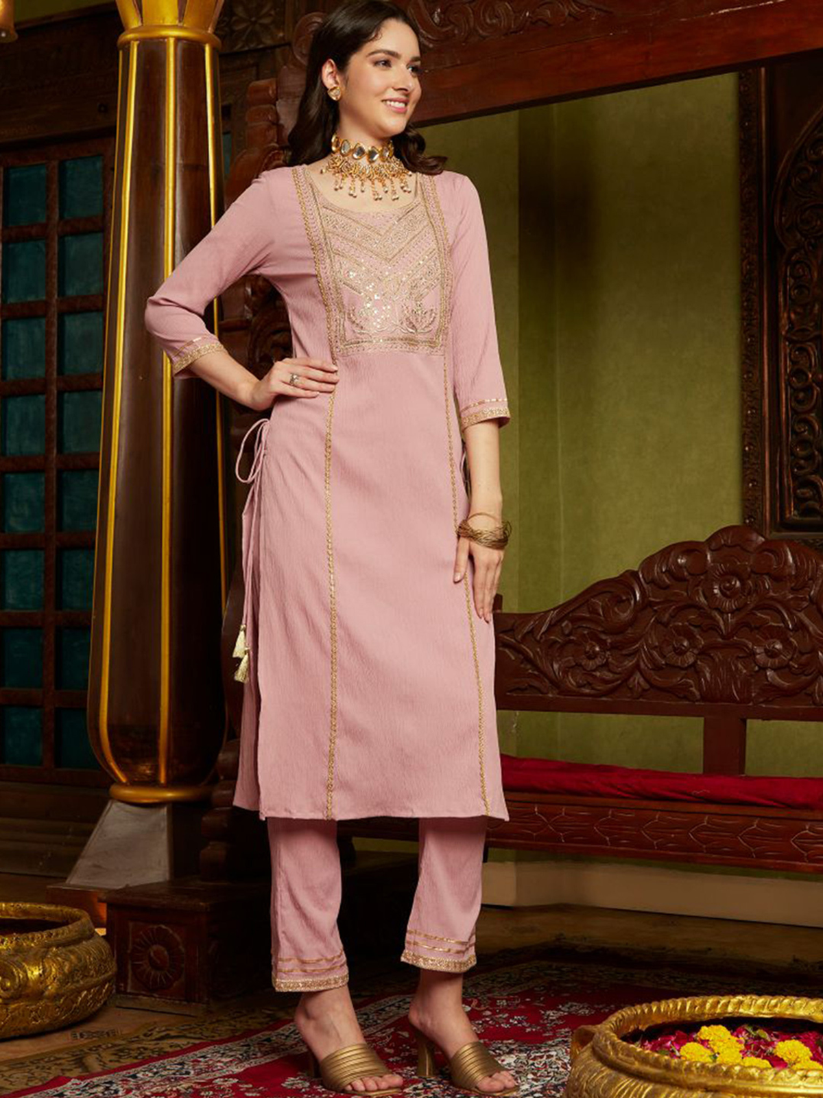 Front view of a mauve embroidered kurta set made of lightweight fabric, perfect for festive occasions