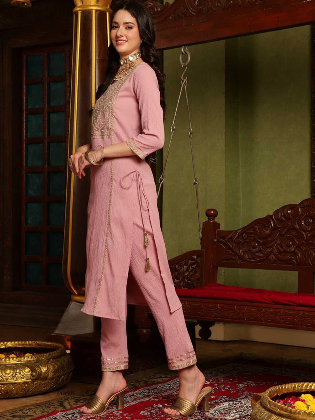 Mauve embroidered kurta set in lightweight fabric with detailed neckline, perfect for festive occasions