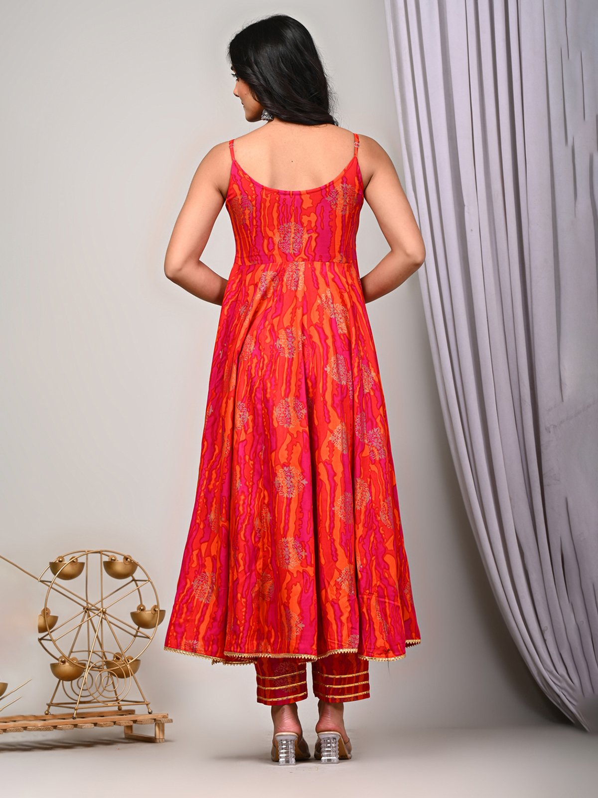 Elegant back view of a mauve floral kurta set with a flared silhouette and intricate design details