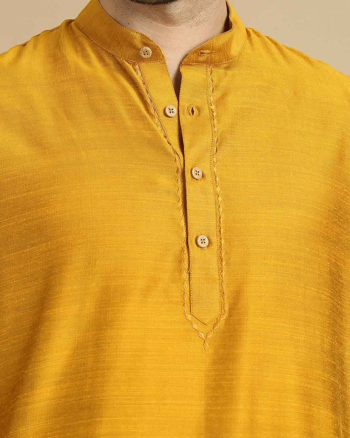 Stylish men's cotton kurta pyjama set in vibrant yellow with traditional button detailing
