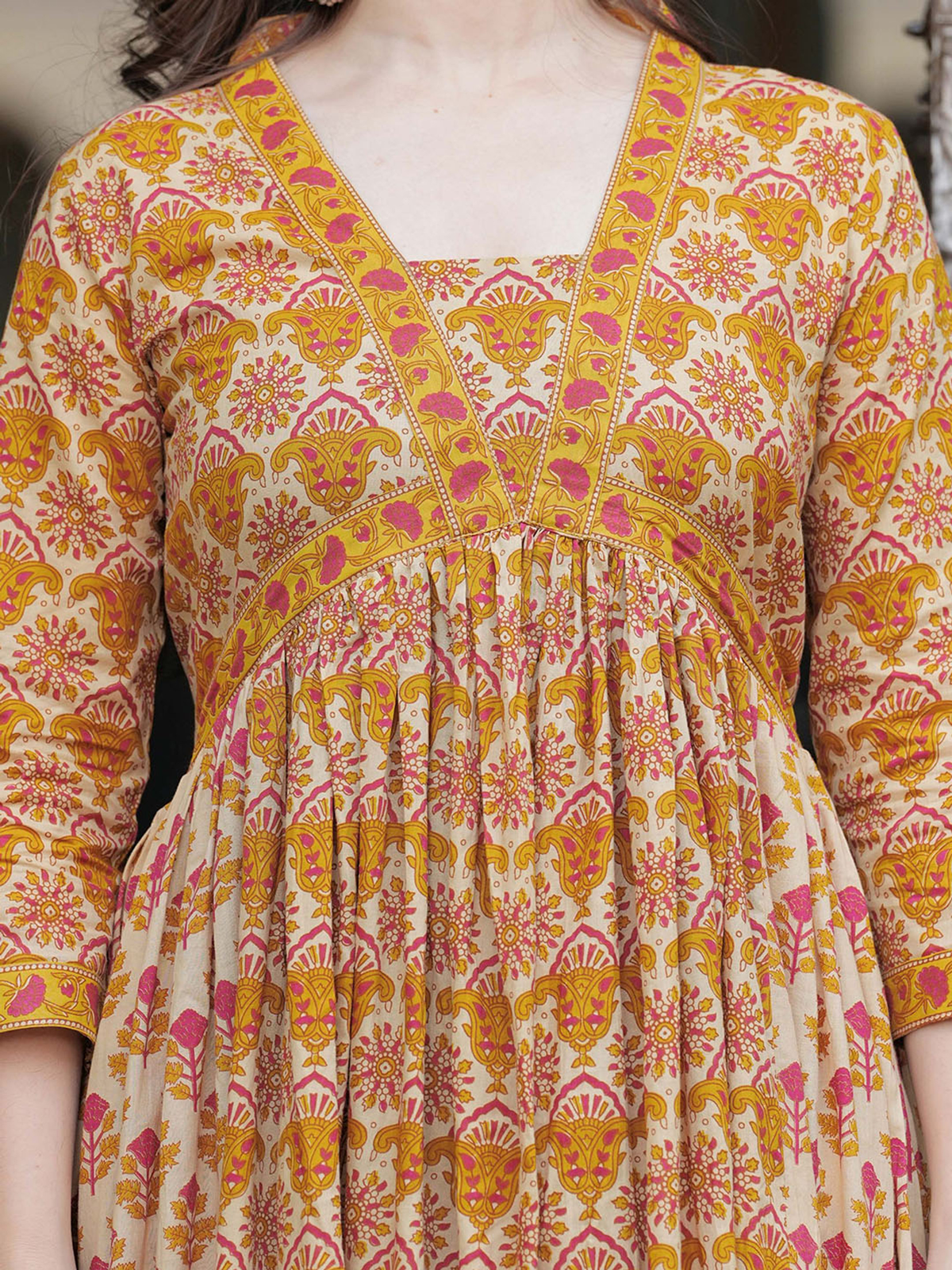 Front view of a mustard yellow anarkali kurta set made from lightweight fabric, perfect for festive occasions.