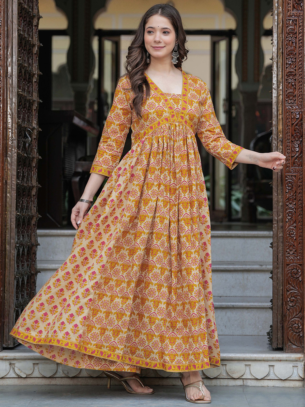 Front view of a mustard yellow anarkali kurta set in floral print, ideal for festive occasions, crafted in comfortable fabric