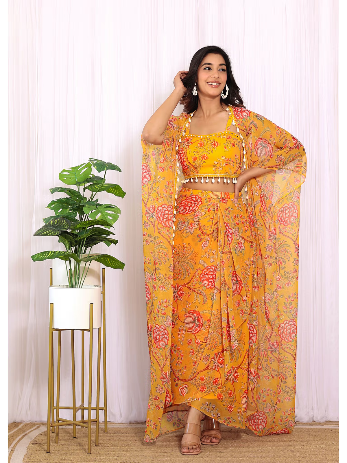 Mustard yellow co-ord set with skirt and shrug featuring floral patterns and elegant styling for festive occasions