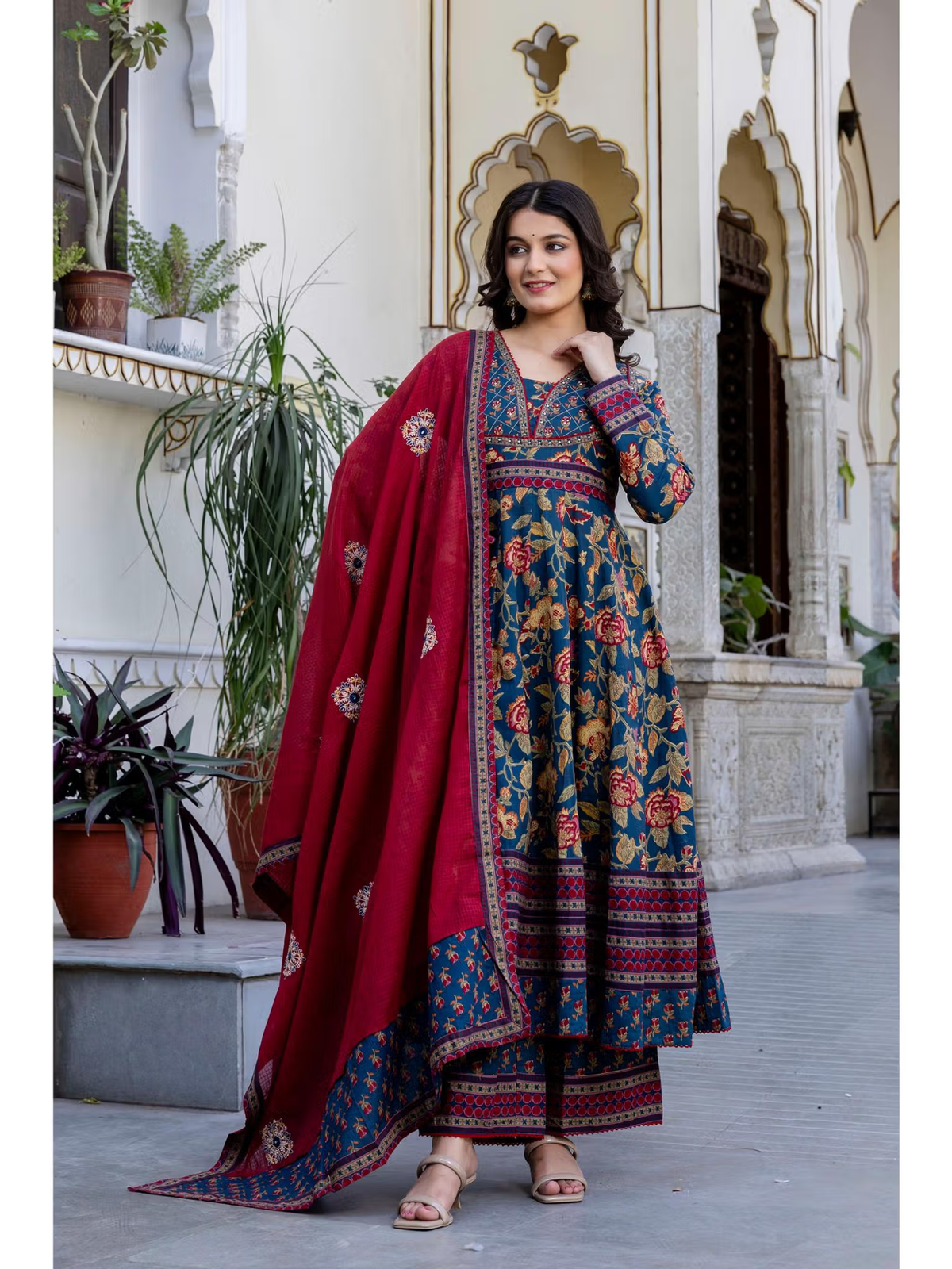Navy blue anarkali kurta set Canada featuring floral patterns and red dupatta for elegant occasions.