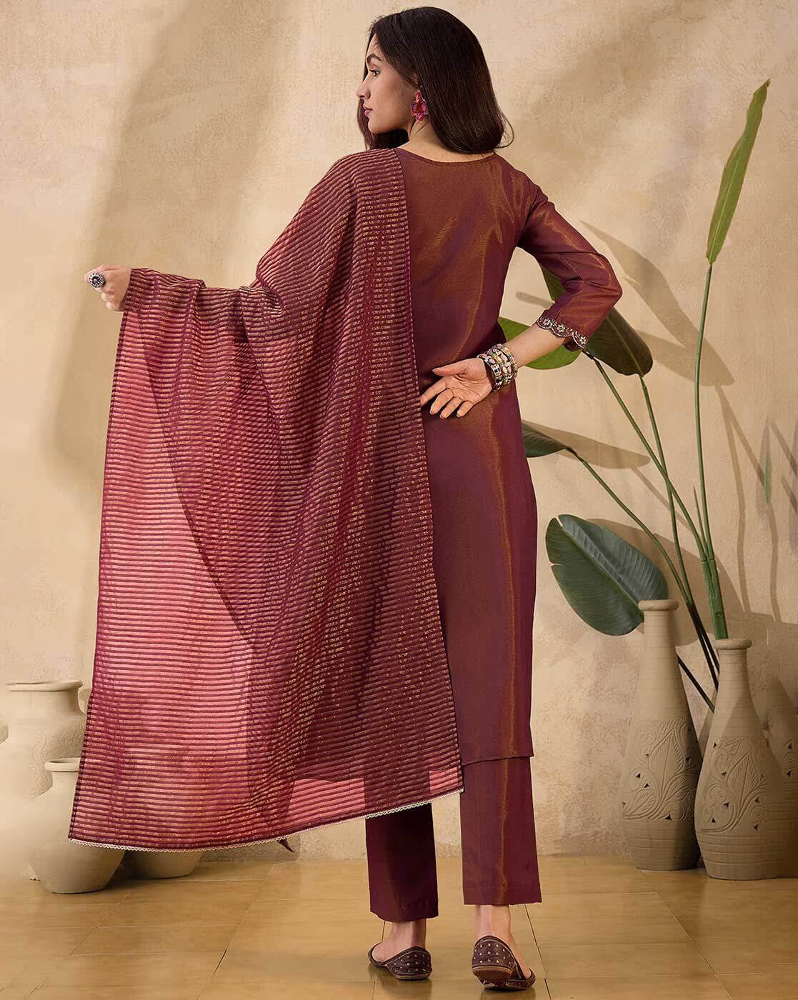 Elegant net embroidered kurta set with matching dupatta in rich maroon color for festive occasions