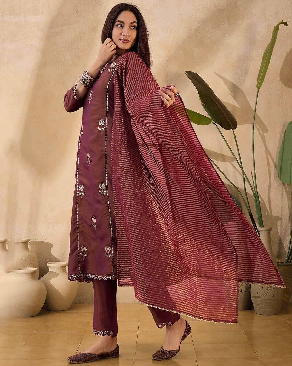 Elegant three piece net embroidered kurta set in rich maroon with stylish dupatta and embellished details