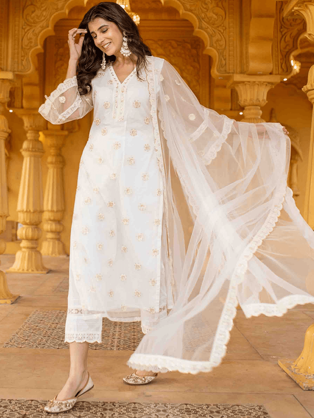 Elegant three piece Kurtha featuring a net embroidered kurta set with delicate floral designs and flowy sleeves