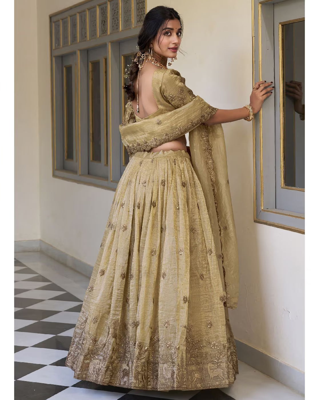 Model in gold embroidered lehenga choli with dupatta and open back blouse elegant embroidered lehenga choli set Canada