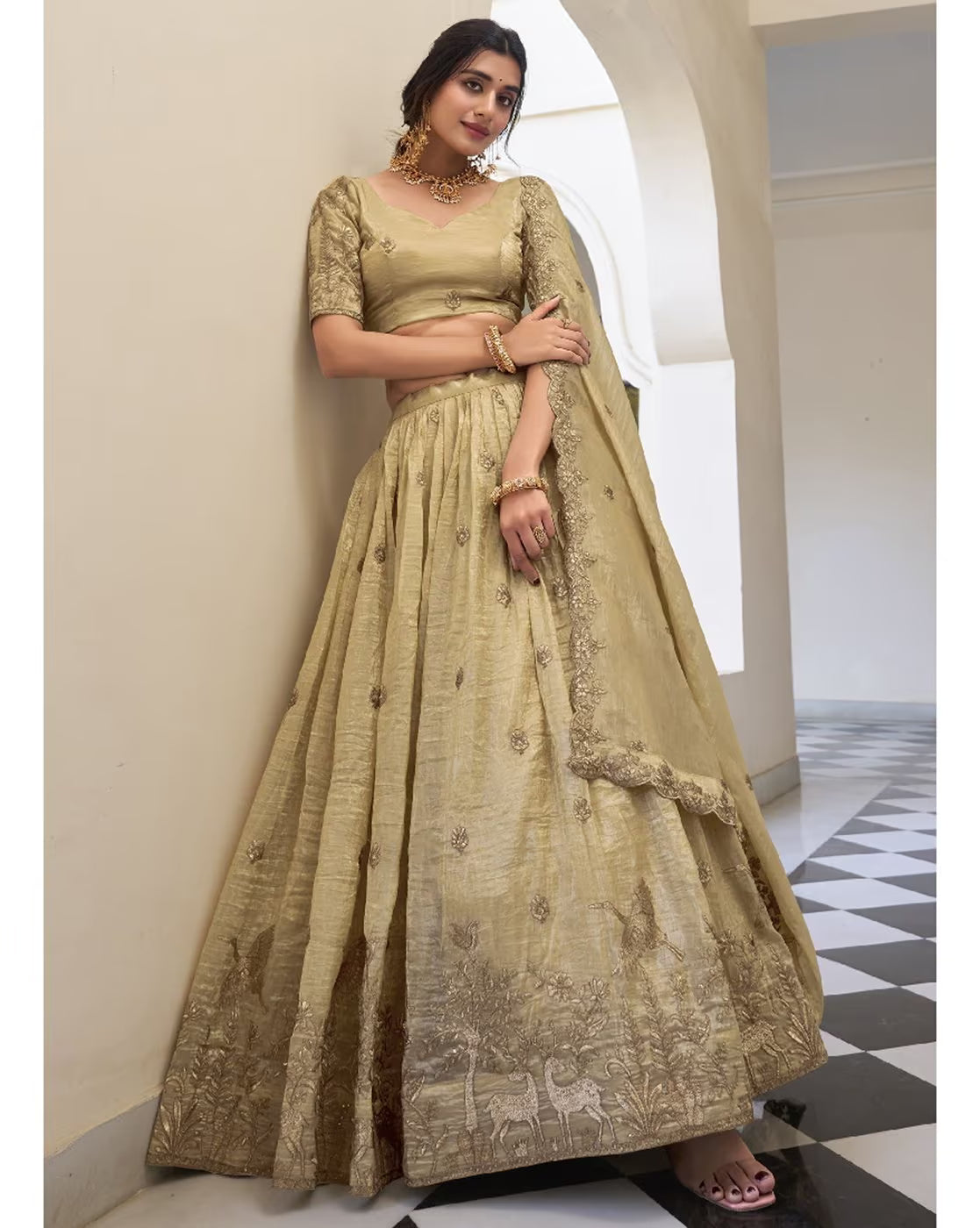 Gold embroidered lehenga choli set Canada with intricate floral and animal border embroidery and matching dupatta