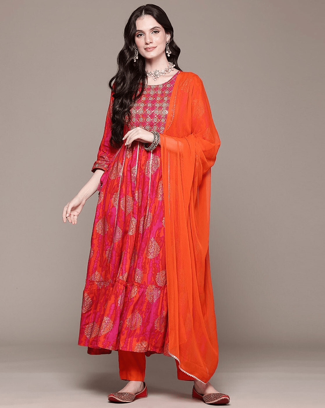 Elegant orange rayon Anarkali set featuring a floral kurta and matching dupatta for festive occasions