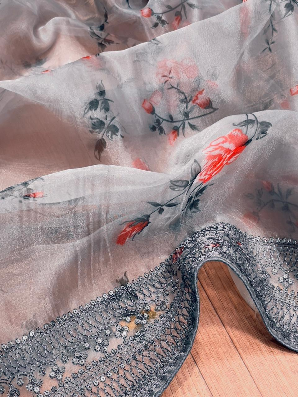 Front view of a grey organza embroidered saree with floral designs, perfect for elegant occasions