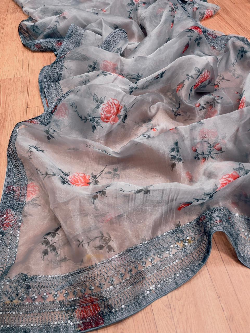 Front view of a grey organza embroidered saree with floral patterns and intricate borders, perfect for weddings.