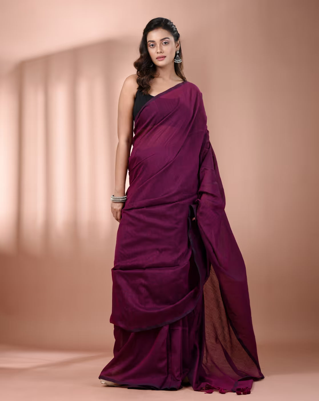 Front view of a burgundy organza saree with stone work Canada, perfect for weddings and special occasions.