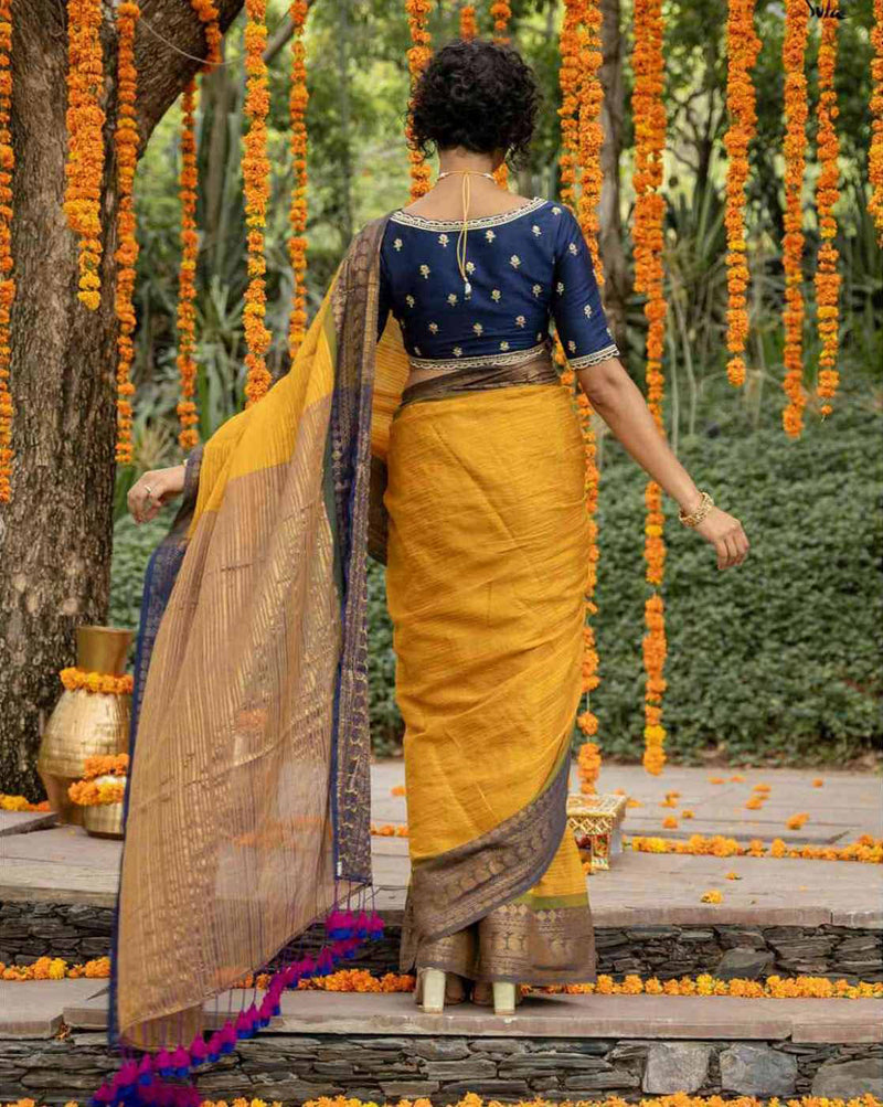 Elegant organza saree with stone work in yellow and gold, perfect for festive occasions