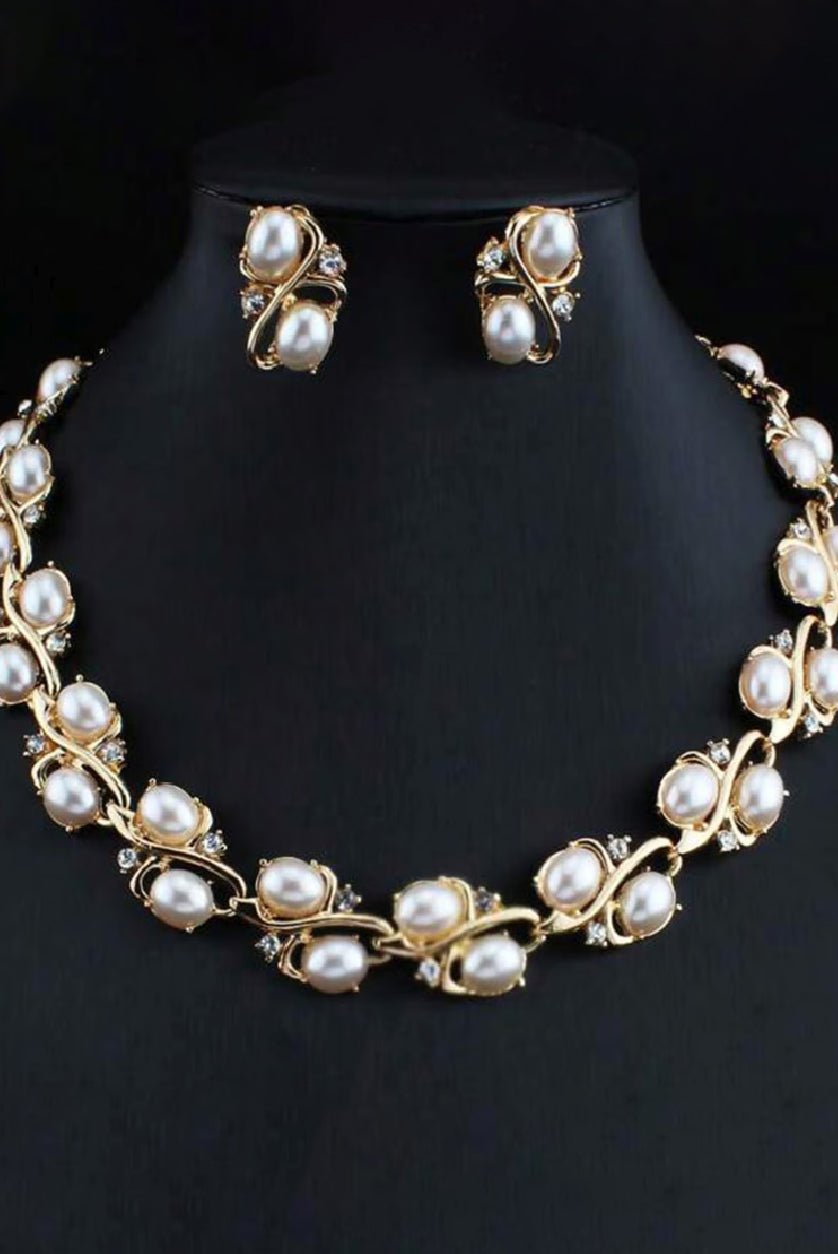 Elegant pearl studded necklace set featuring gold accents and matching earrings for a sophisticated look