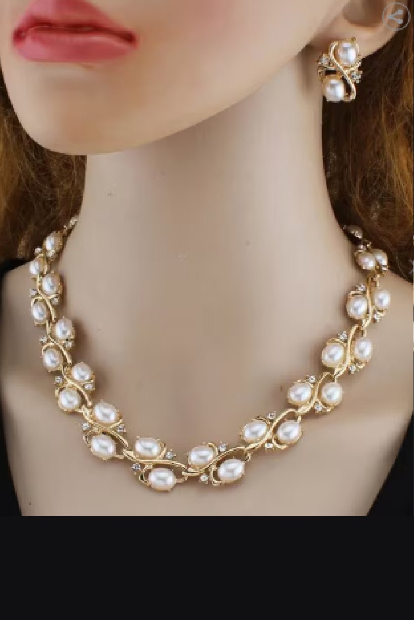 Elegant pearl studded necklace set with matching earrings, perfect for formal occasions.