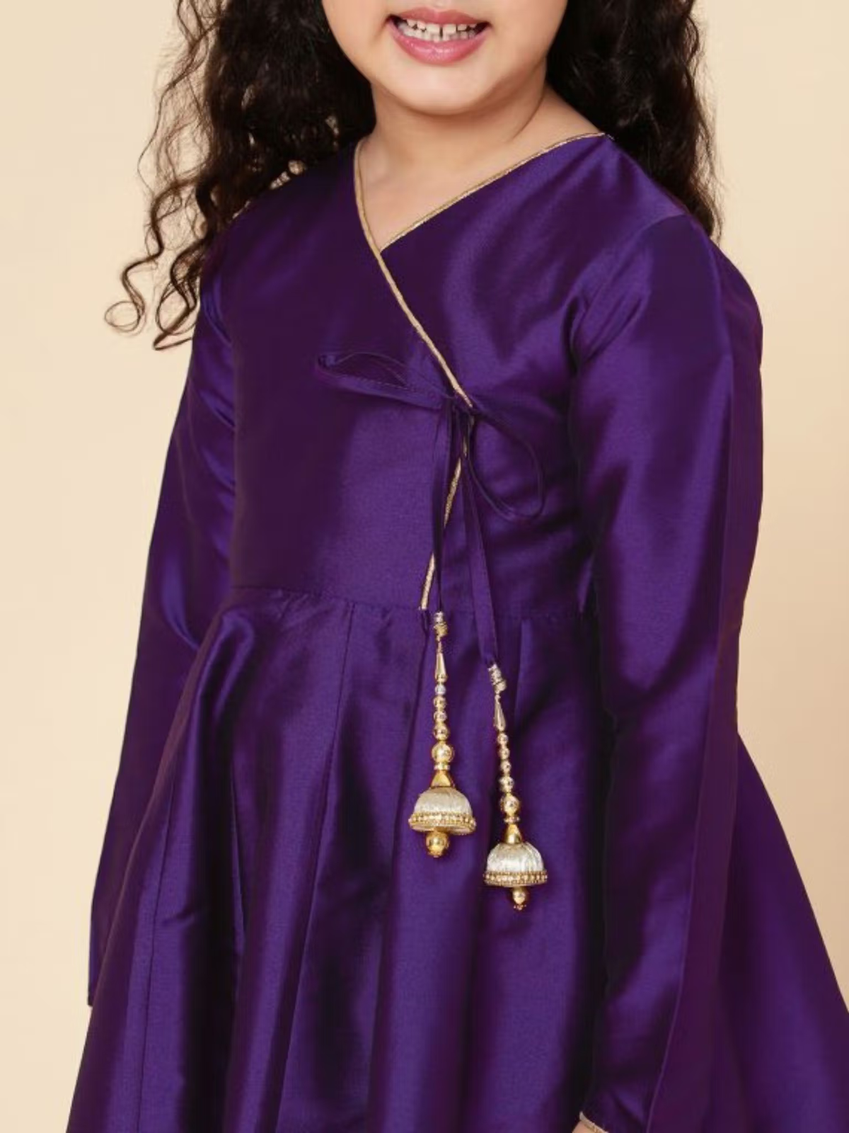Aromie Girls purple satin long sleeve girls fit and flare dress with wrap tie and gold jhumka tassels