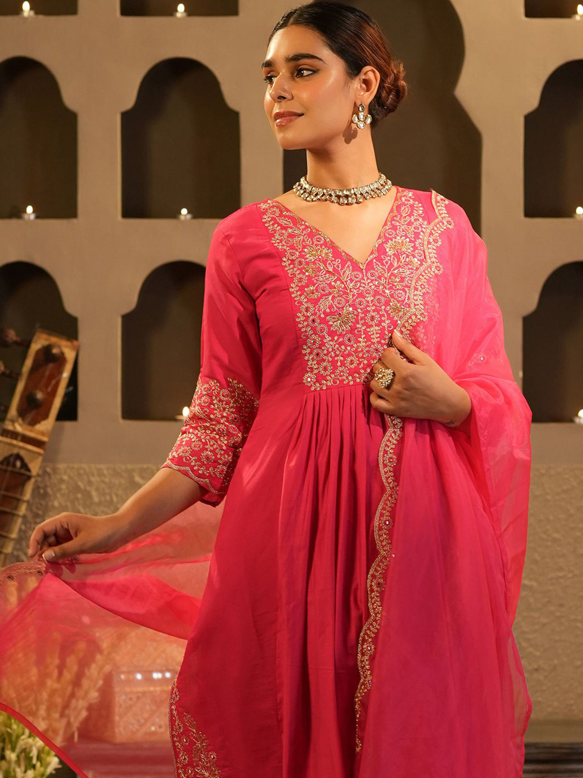 Aromie Pink Banarasi Anarkali set with intricate floral embroidery and flowing silhouette, perfect for festive occasions
