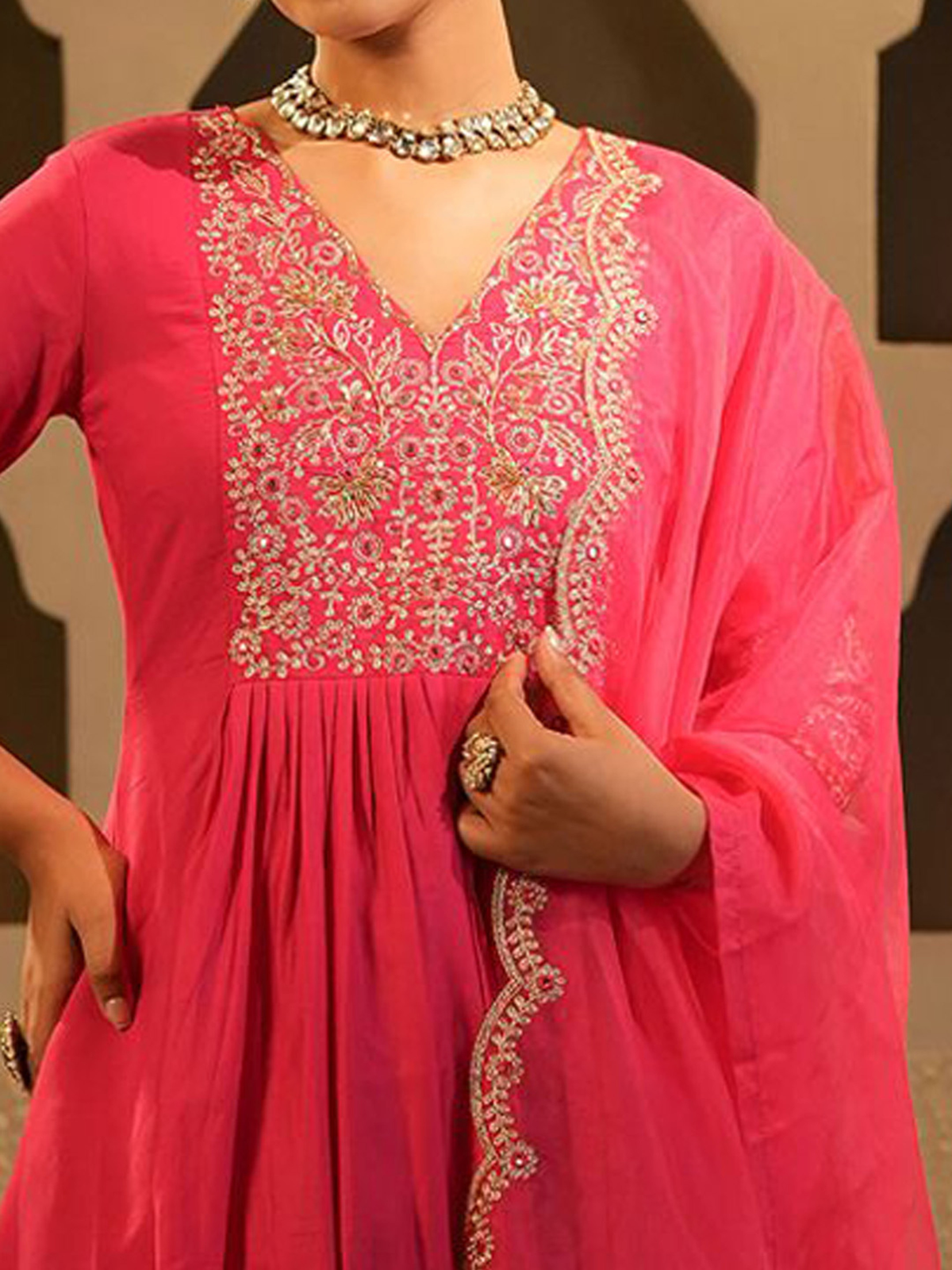Pink Banarasi Anarkali set featuring intricate embroidery and a flowing silhouette for elegant occasions