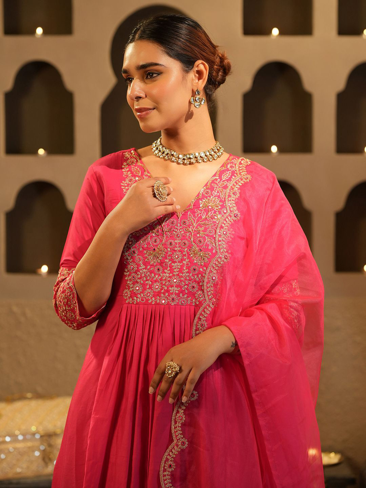 Elegant Pink Banarasi Anarkali set featuring intricate embroidery and flowy design