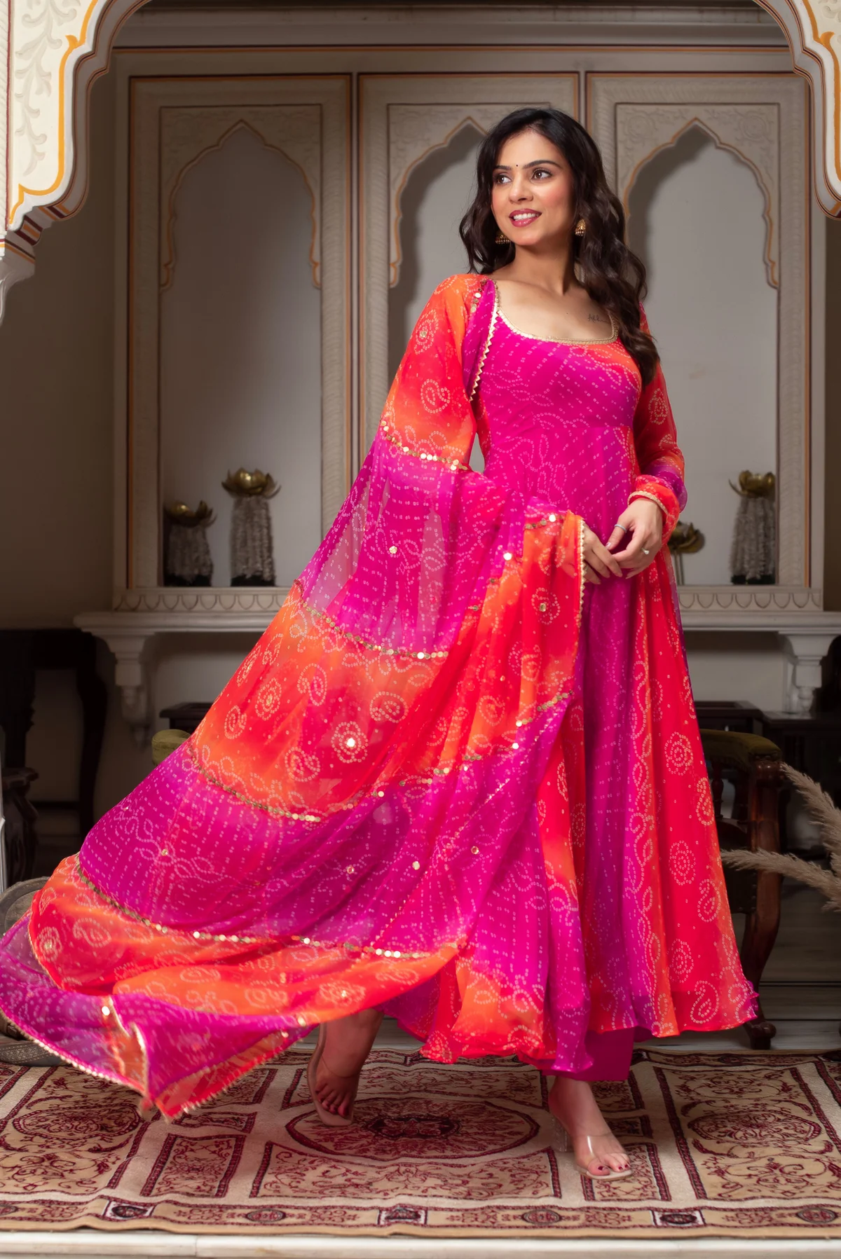 Front view of a Pink Bandhani Anarkali suit Canada, featuring vibrant colors and lightweight fabric, ideal for festive occasions.