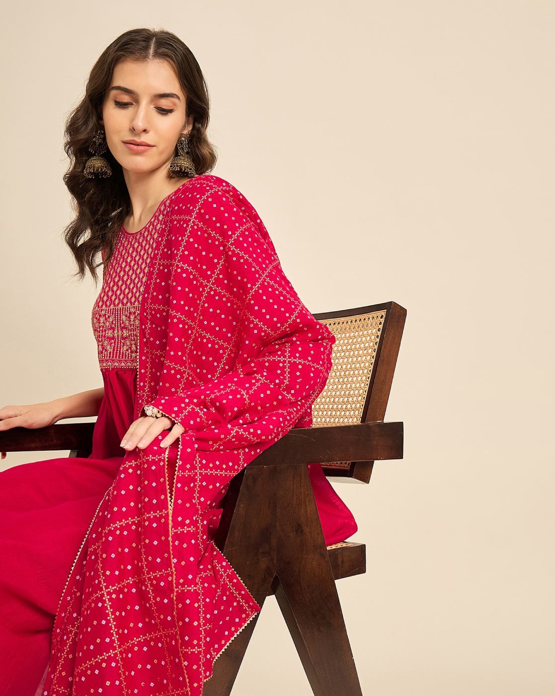 Elegant pink embroidered kurta set with intricate detailing, perfect for festive occasions or casual wear.