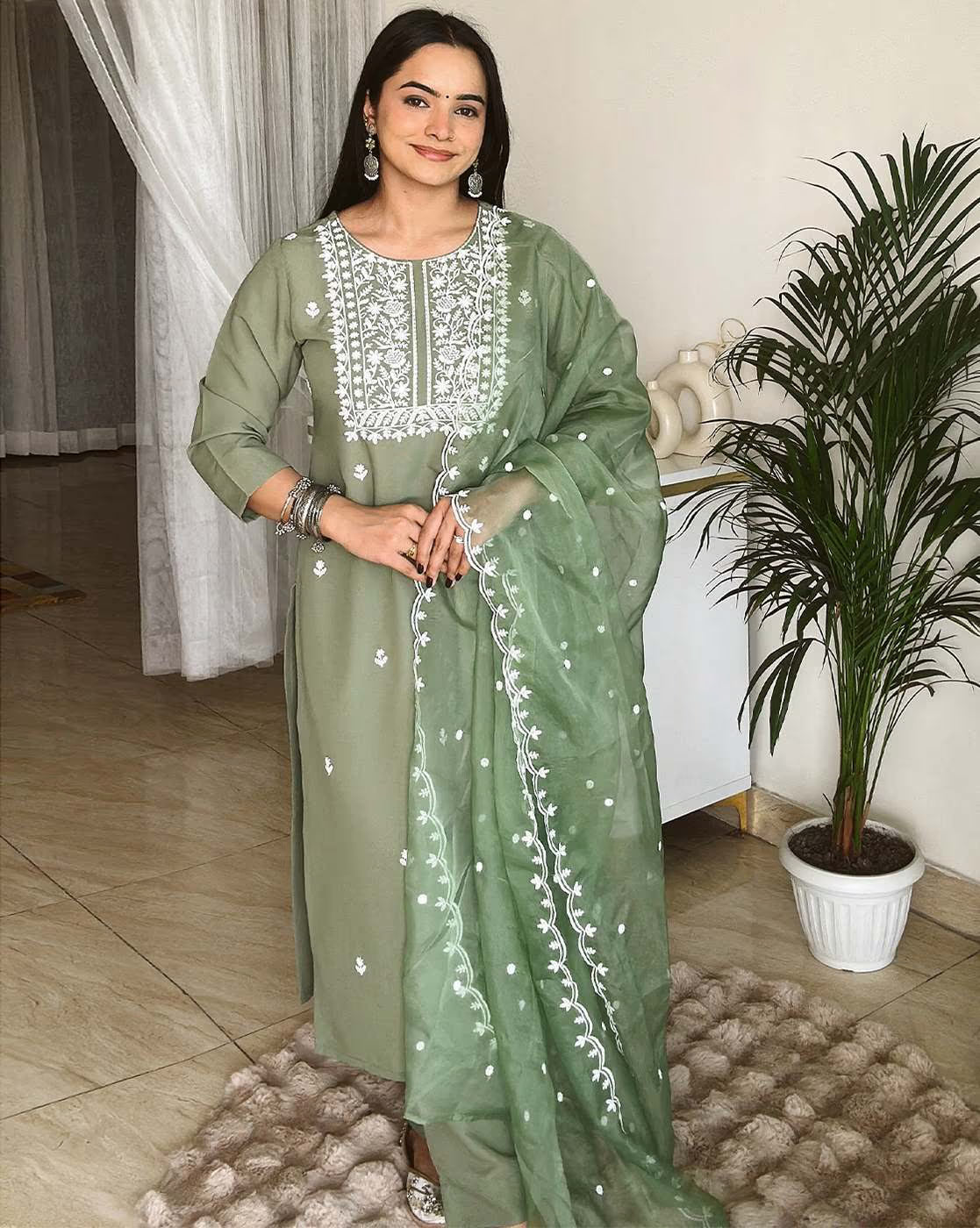 Elegant green three piece set featuring a Polka dot kurta for women with intricate embroidery and matching dupatta