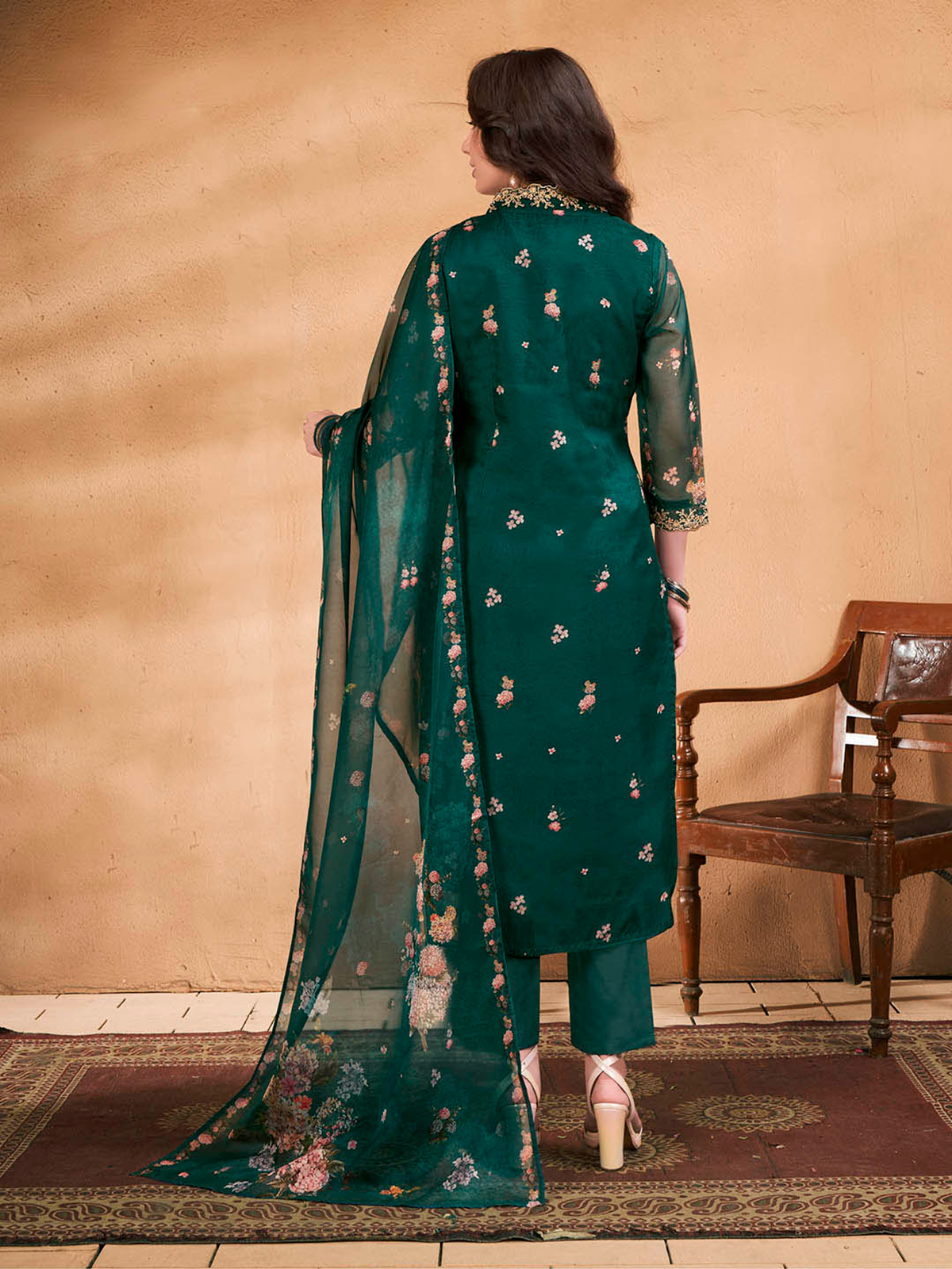 Women wearing a purple floral cotton kurta set with a sheer dupatta and intricate embroidery