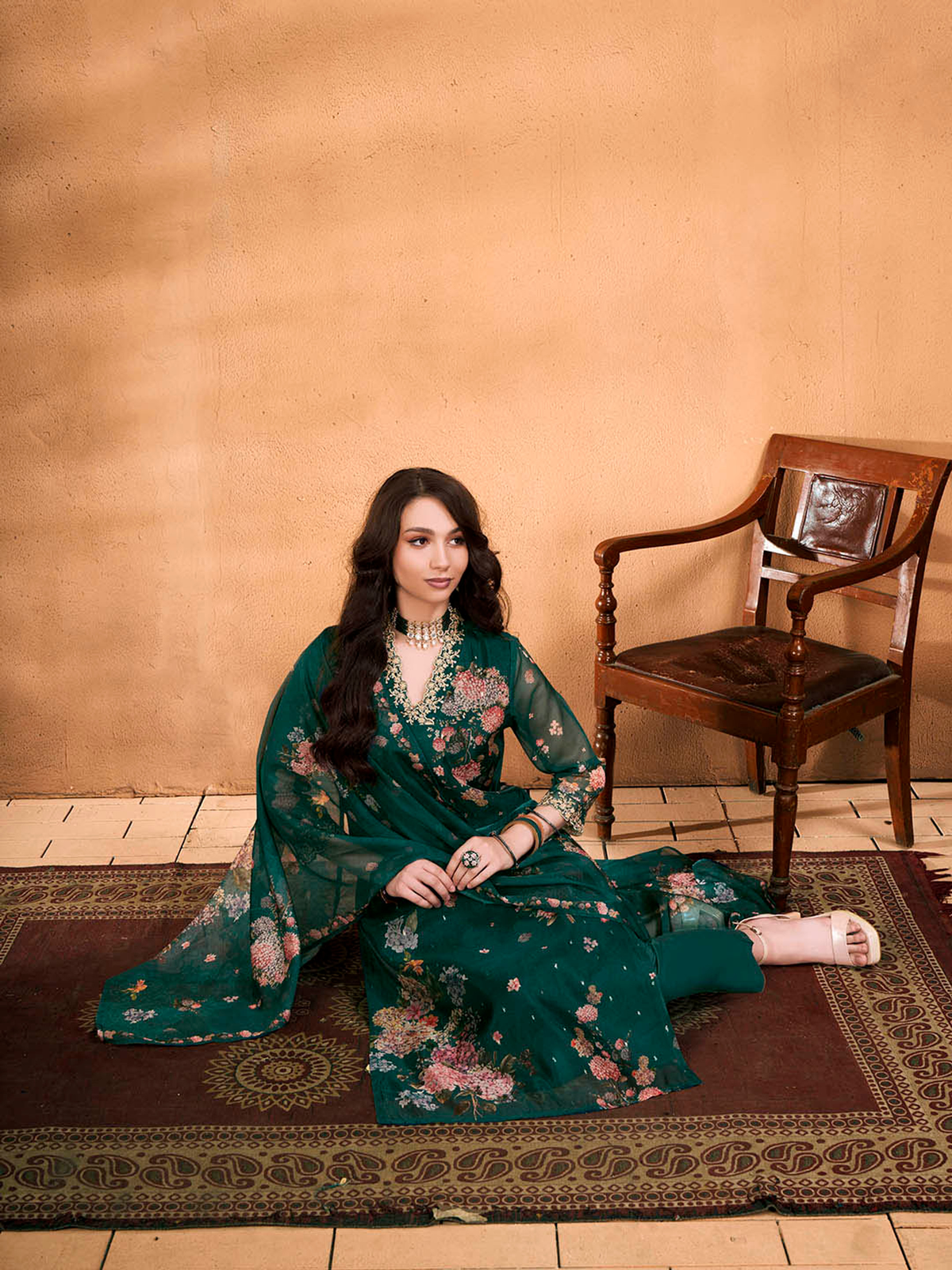 Elegant woman wearing purple floral cotton kurta set, showcasing traditional style and comfortable fit