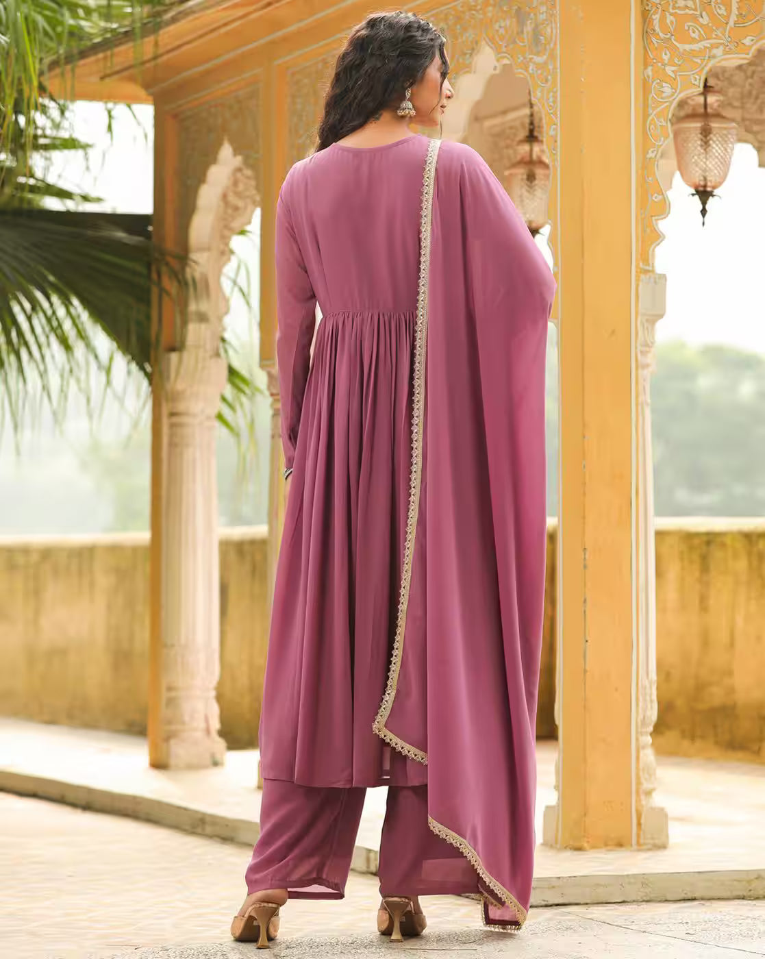 Back view of woman wearing mauve pleated kurta with trimmed dupatta and palazzo pants by aromie Floral Kurta Set for Women