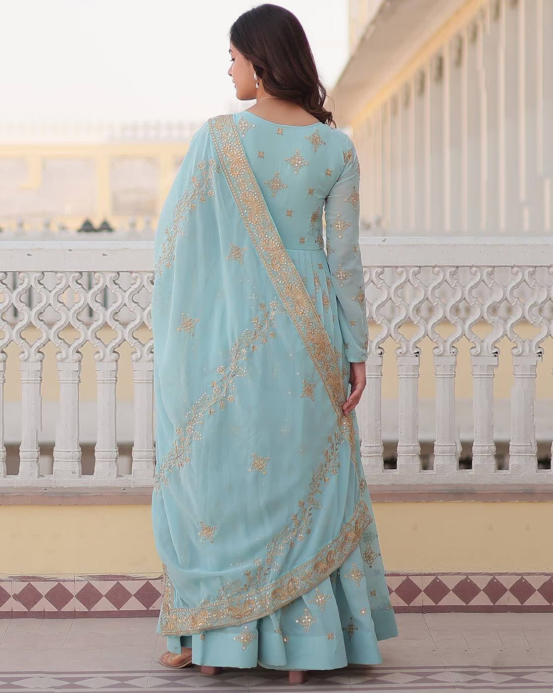 Aromie three piece Kurtha with dupatta draped over shoulder in pastel blue with gold embroidery Orange Geometric Angrakha Anarkali