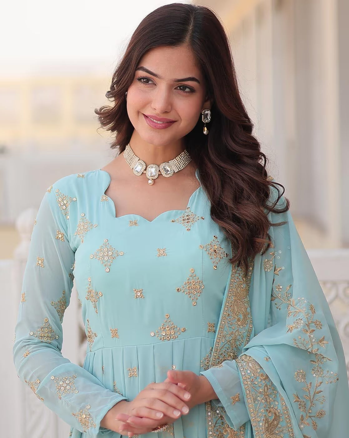 Aromie three piece kurtha in pastel blue with gold embroidery modeled by woman Orange Geometric Angrakha Anarkali
