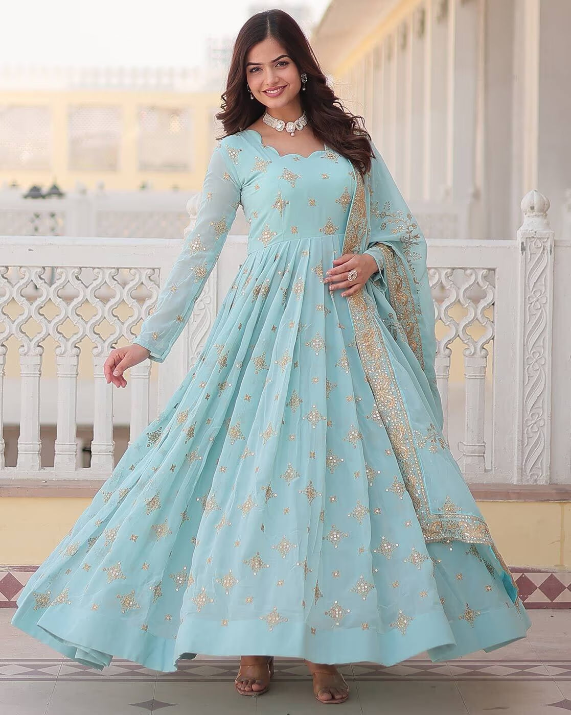 Aromie three piece Kurtha pastel blue gown with gold embroidery worn by model Orange Geometric Angrakha Anarkali