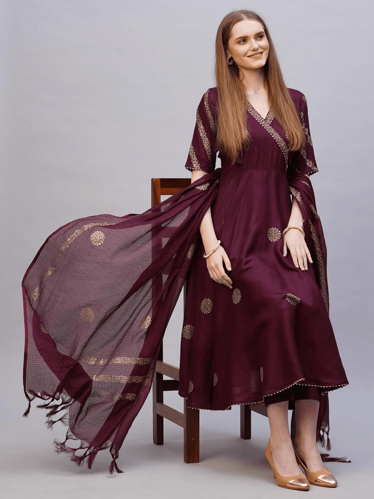 Elegant Rayon Anarkali Kurta Set in deep maroon with intricate gold detailing and a matching dupatta