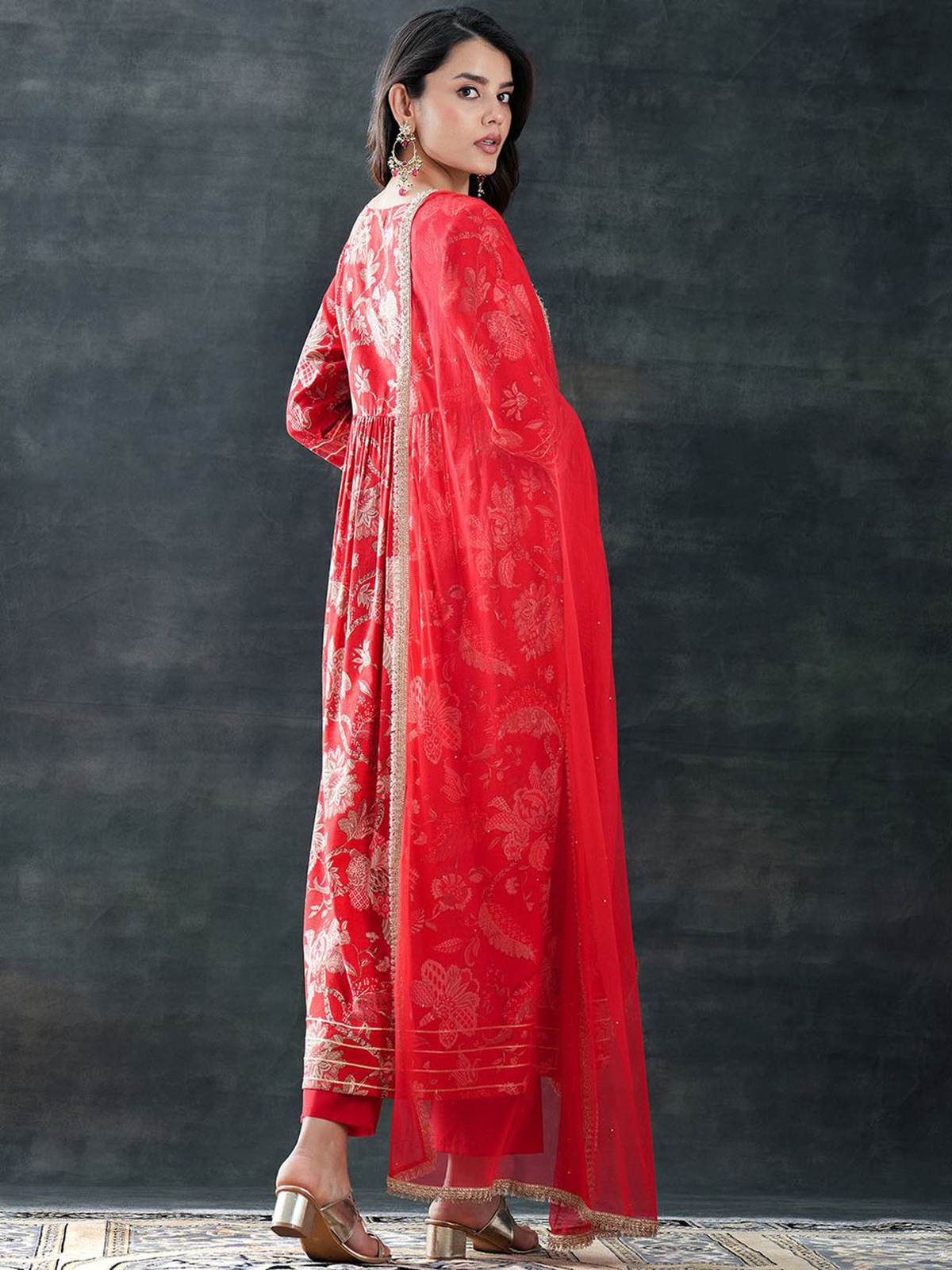 Elegant red Rayon printed outfit set with intricate floral patterns and a flowing silhouette
