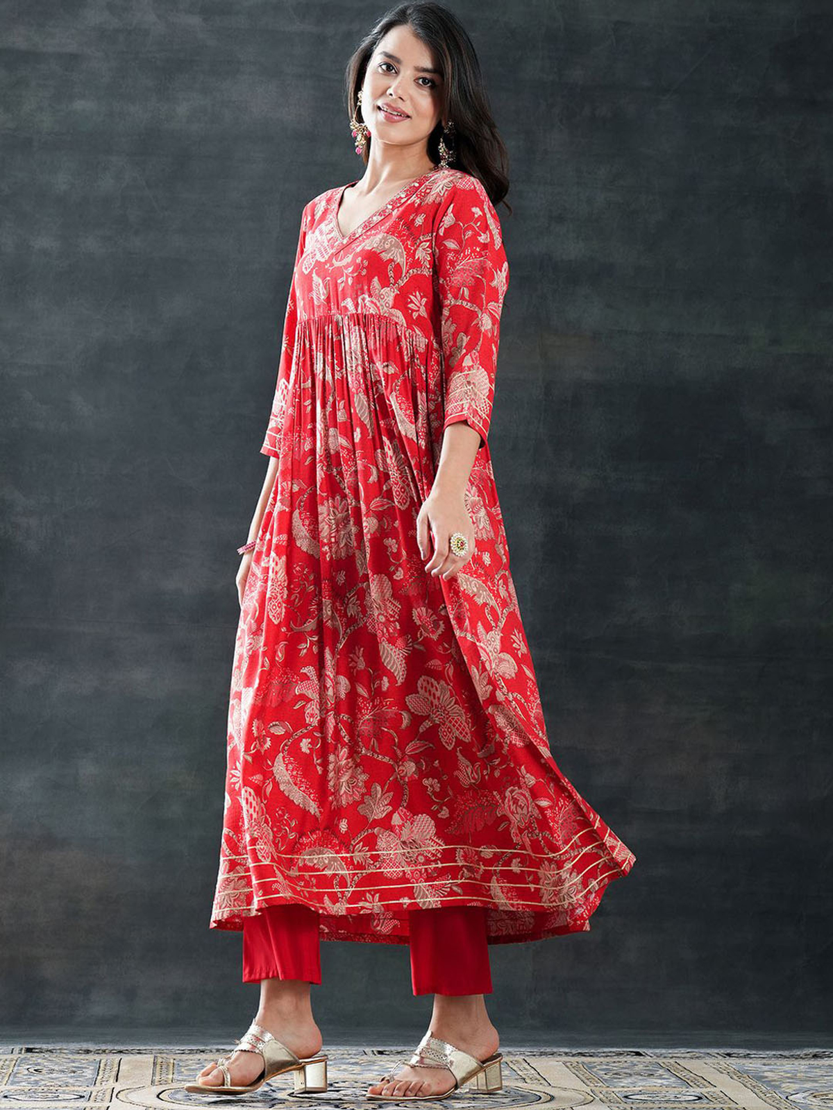 Aromie rayon printed outfit set featuring a red Kurtha with intricate floral designs and flowing silhouette
