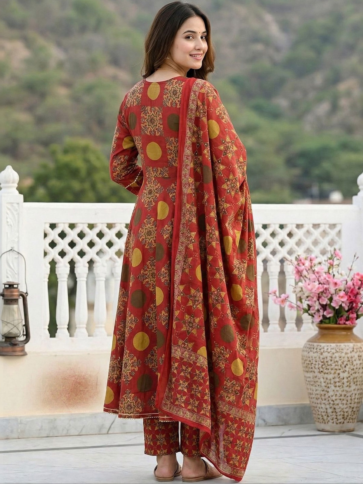 Red anarkali kurta set with dupatta in vibrant floral print, perfect for festive occasions or weddings