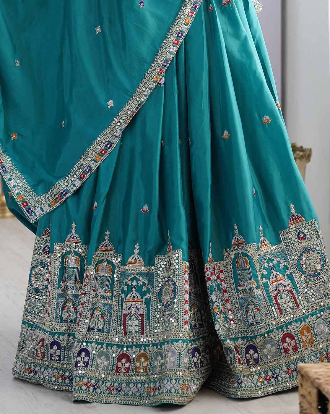 Teal silk lehenga with ornate mirror and zari embroidery along hem embroidered lehenga choli set Canada for weddings