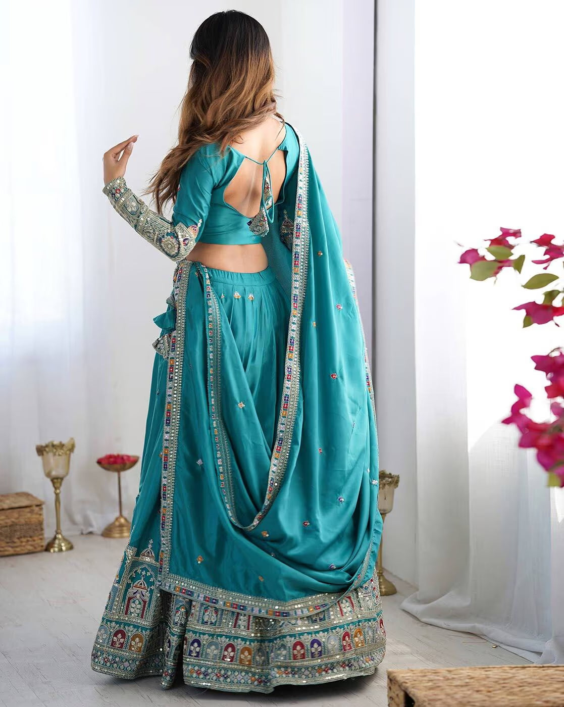 Back view turquoise embroidered lehenga choli set Canada with open back blouse tie and ornate border dupatta