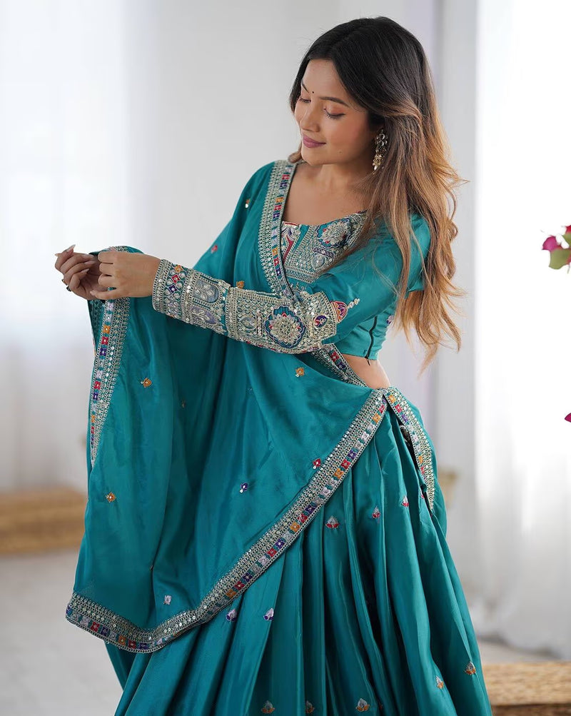 Teal embroidered lehenga choli set Canada with intricate silver embroidery on blouse sleeves and dupatta