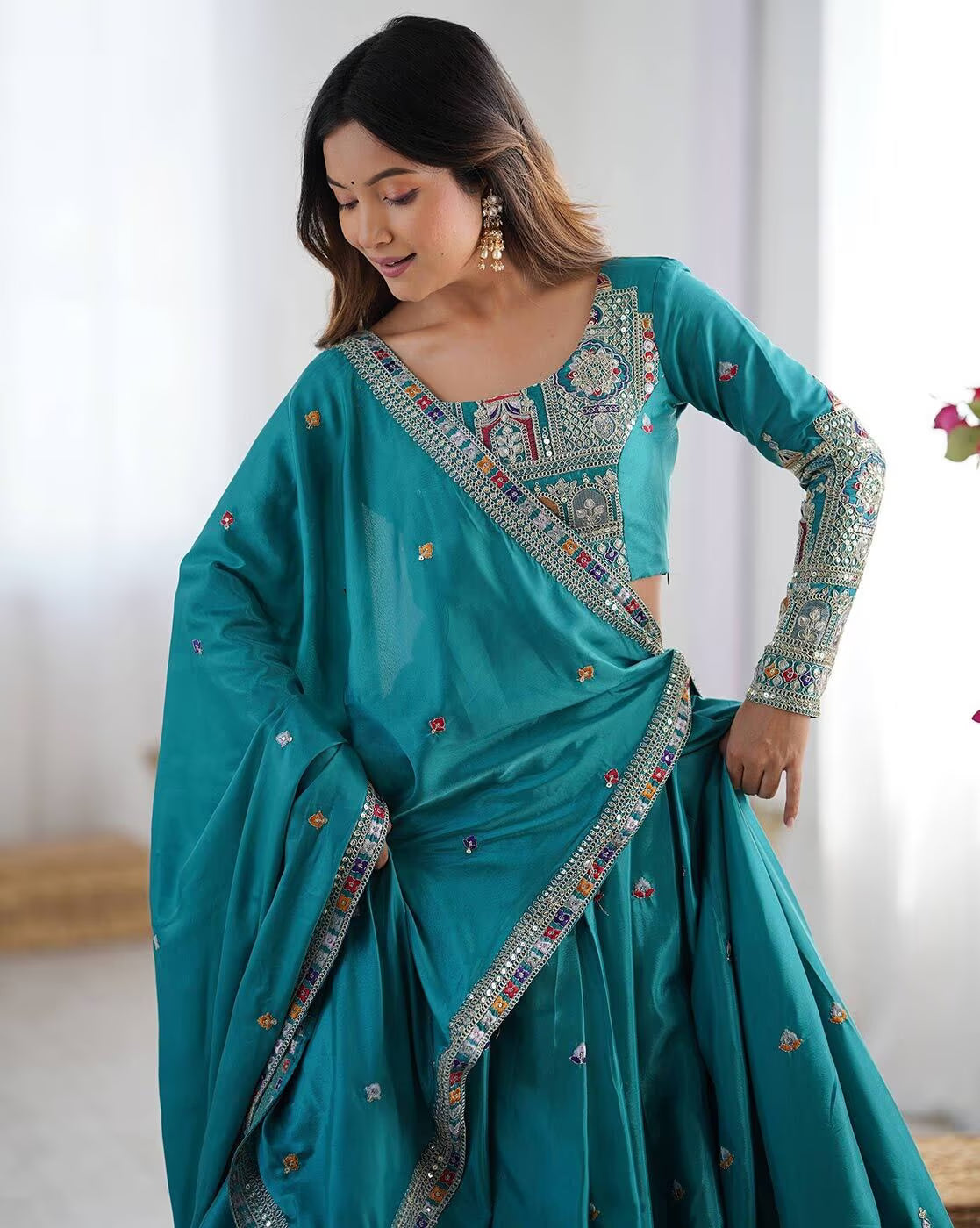 Teal embroidered lehenga choli set Canada with mirrorwork border embroidered long sleeve blouse and flared skirt