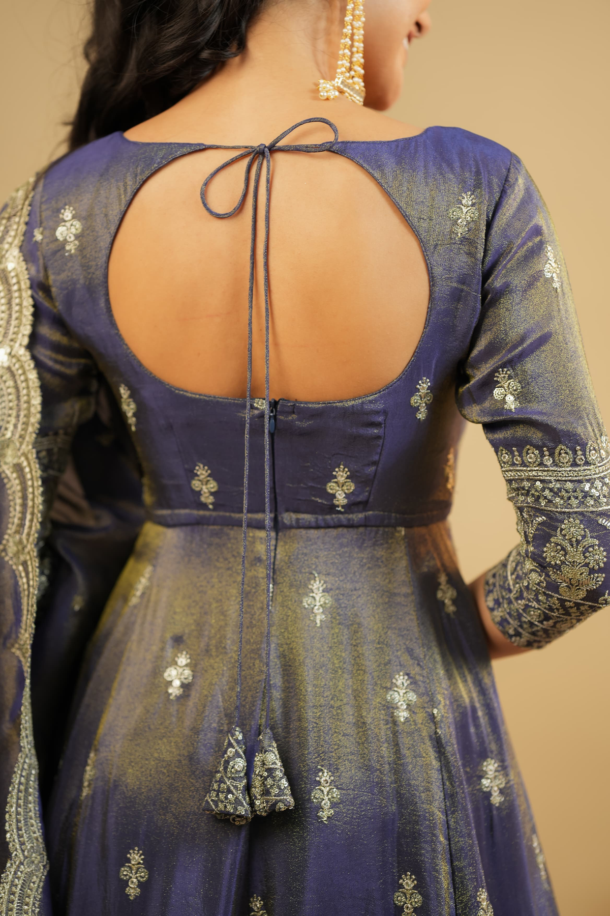 Detail view of a royal purple Anarkali suit Canada featuring intricate embroidery and a stylish back design