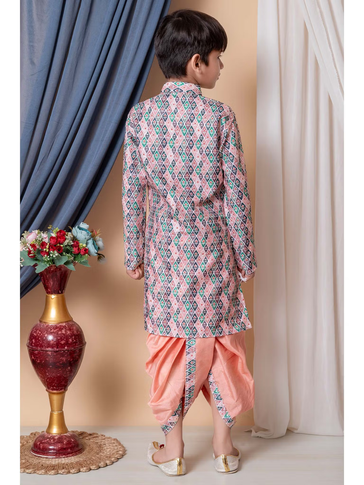 Back view of boy wearing printed pastel long kurta and peach dhoti with gold sandals boys silk kurta dhoti set Canada