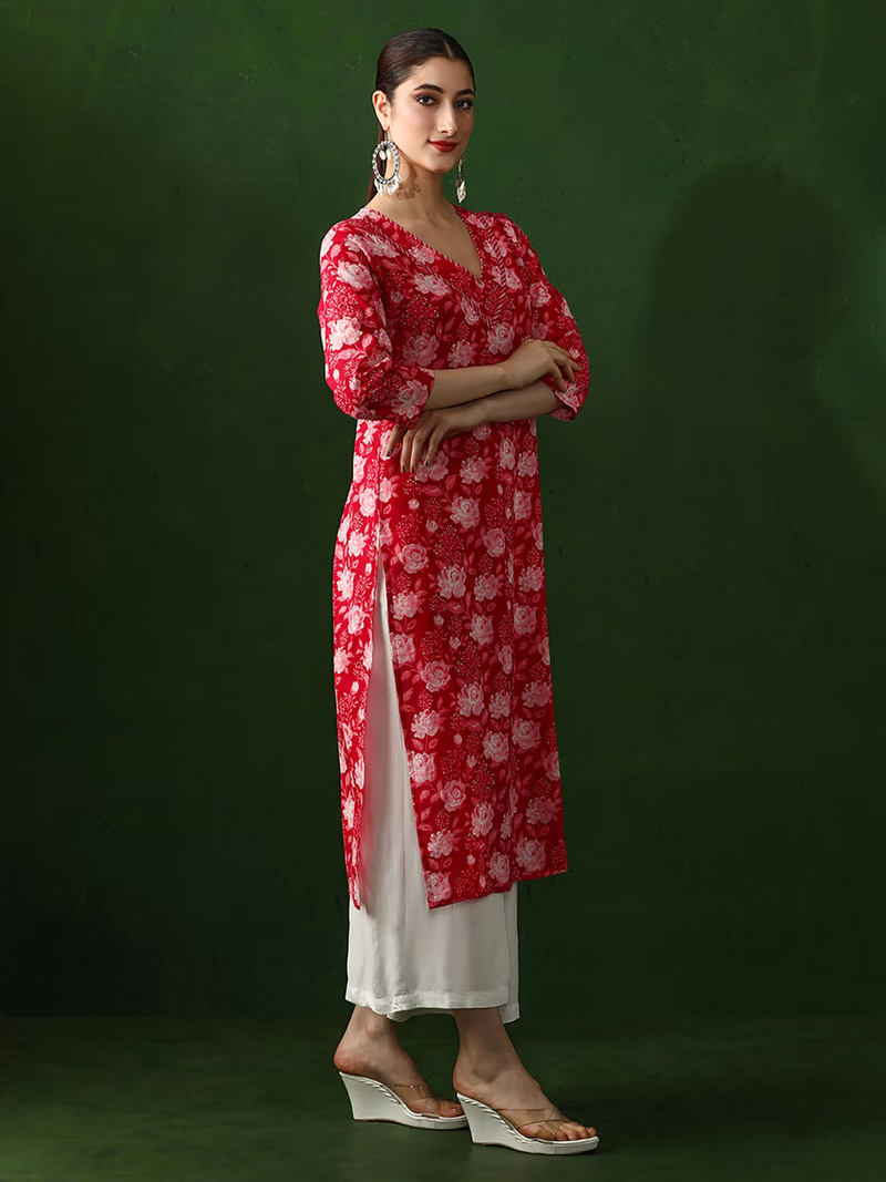 aromie embroidered viscose jumpsuit for women styled as red floral single piece kurta with white palazzo and earrings
