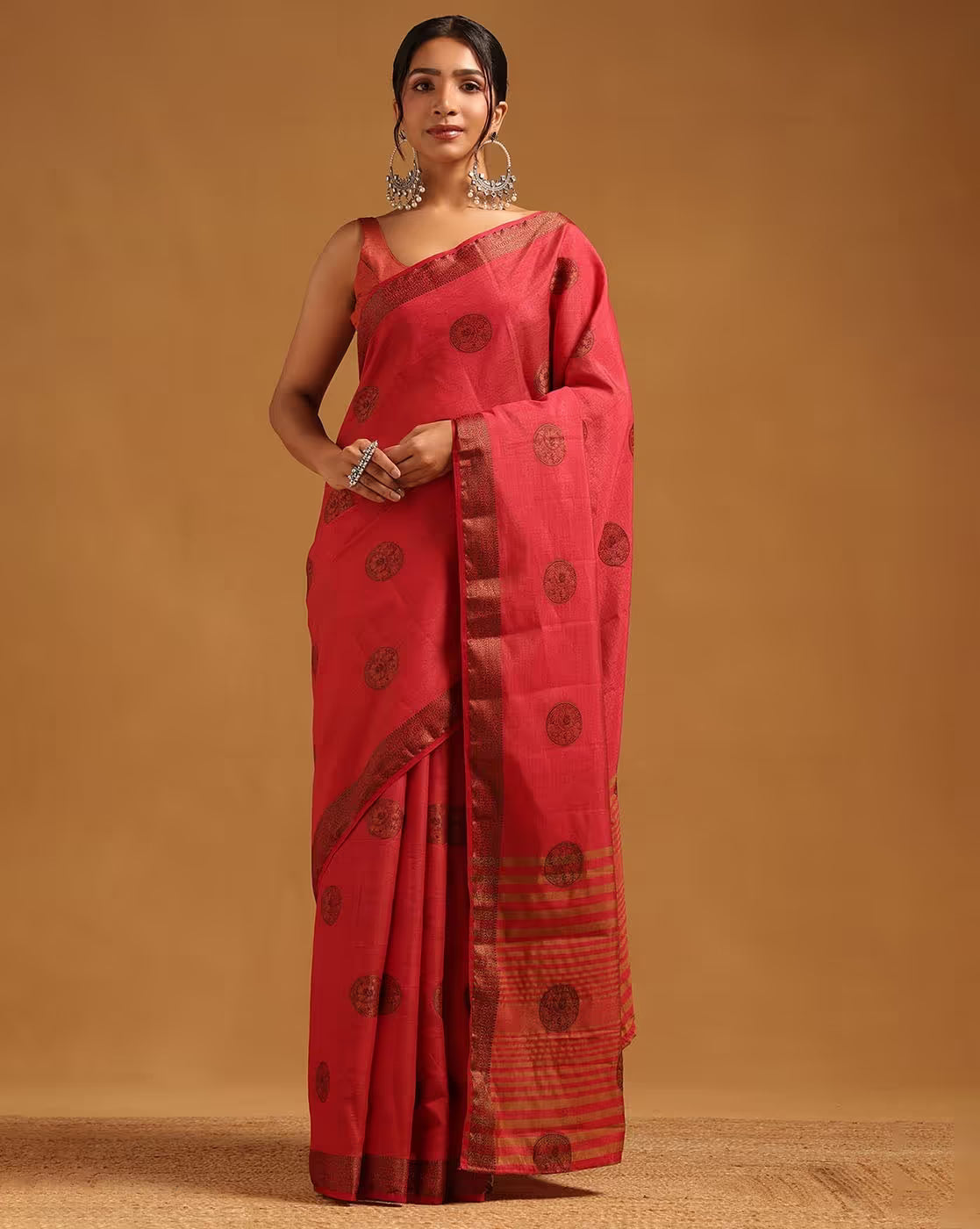 Front view of a red affordable cotton silk saree Canada with intricate gold patterns, perfect for festive occasions.