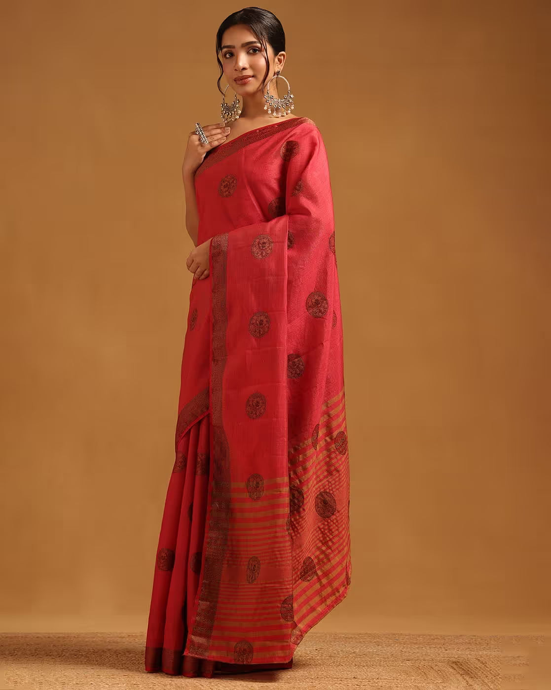 Front view of a red affordable cotton silk saree Canada with intricate patterns, perfect for festive occasions.