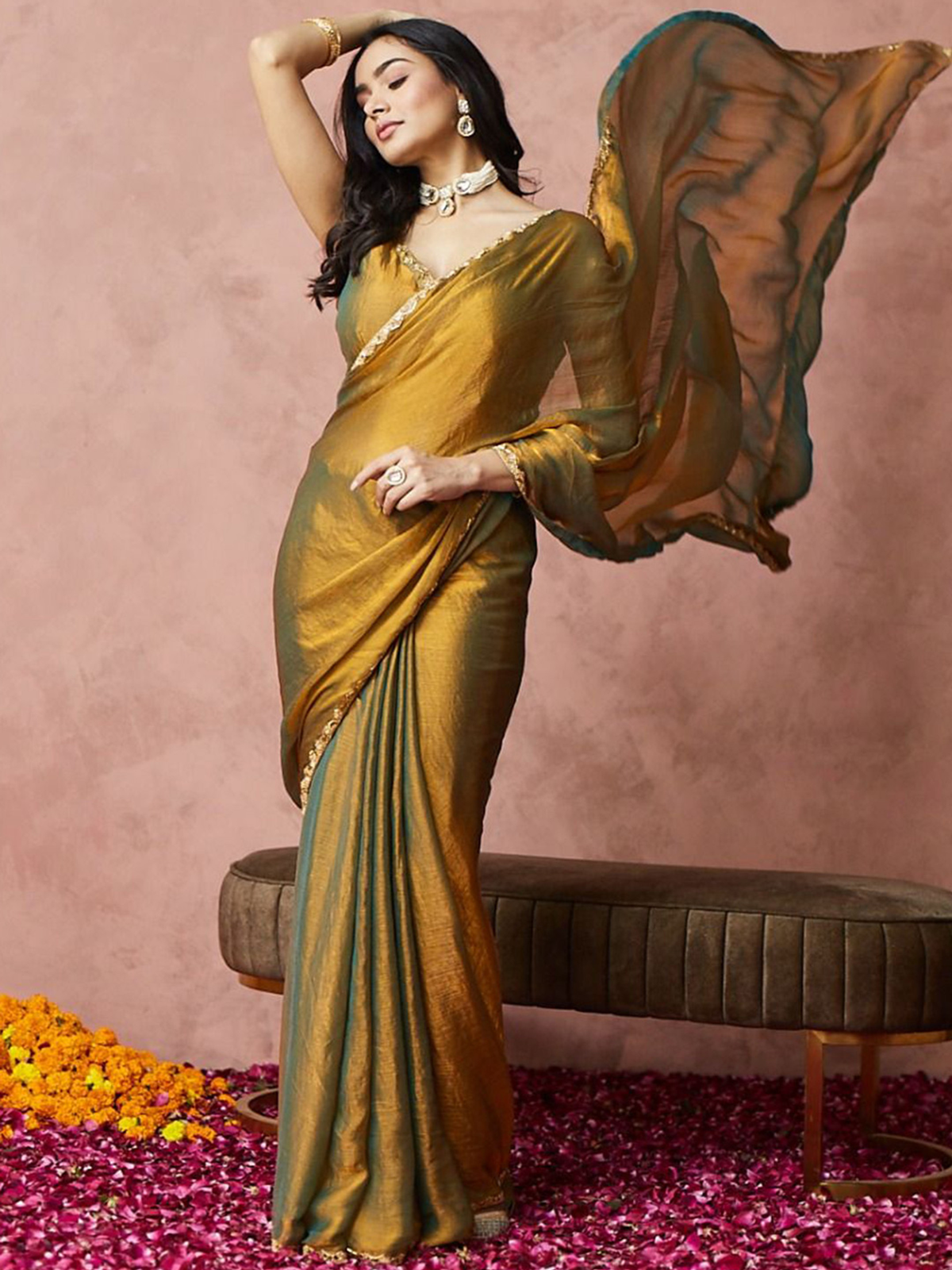 Front view of a gold-toned saree from aromie, perfect for weddings in Canada, made of luxurious fabric